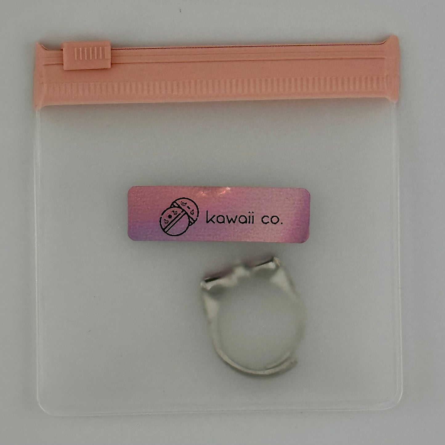 Adjustable Silver Bow Ring with Pink Heart Gems β Sparkle Edition