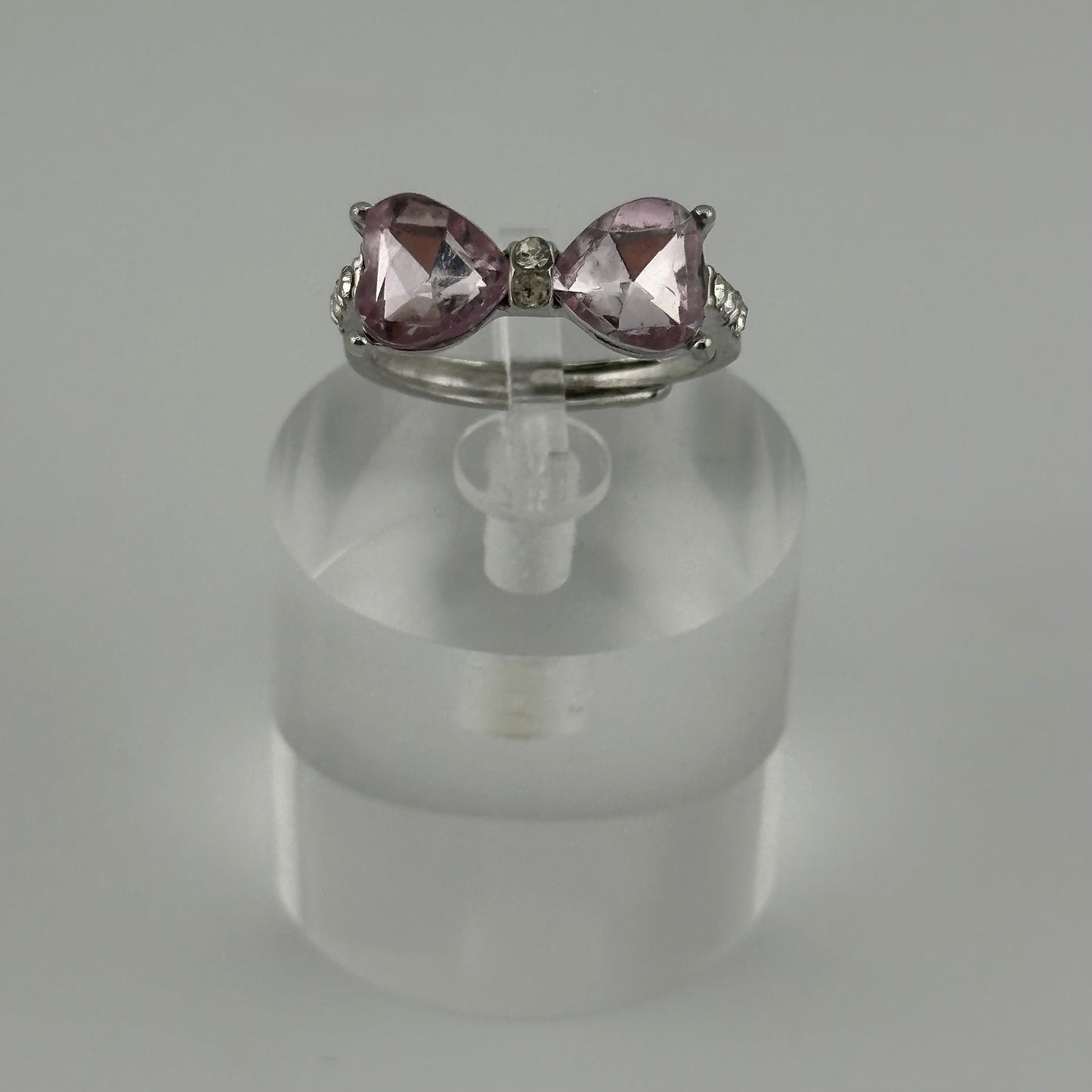 Adjustable Silver Bow Ring with Pink Heart Gems β Sparkle Edition